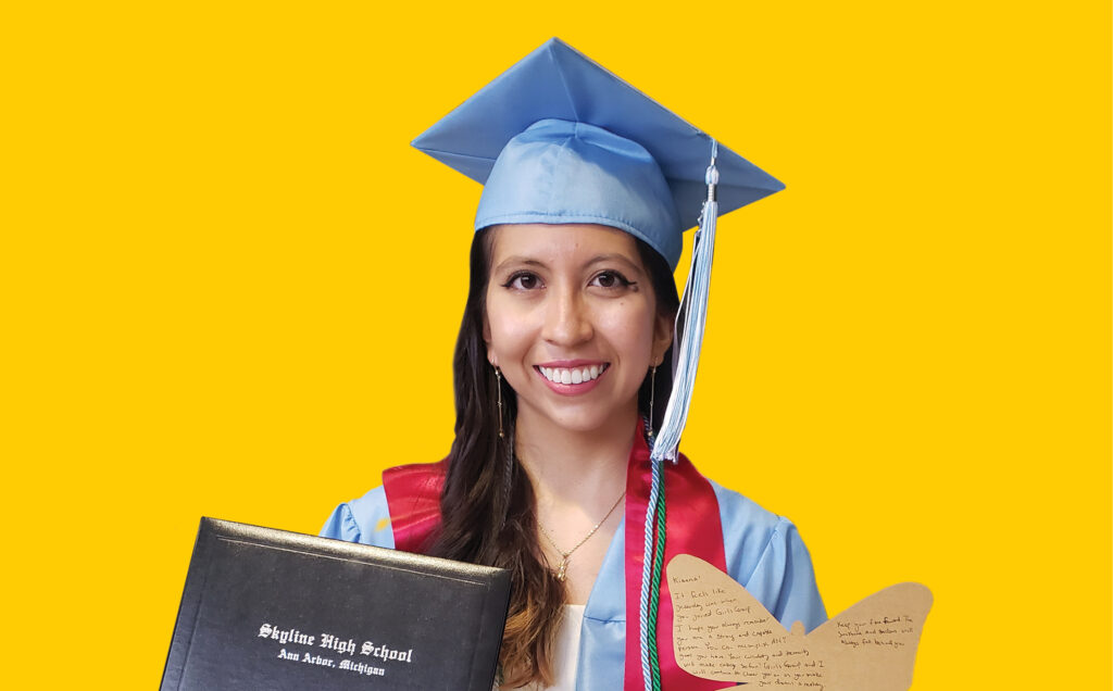 Kianna in high school graduation cap and gown