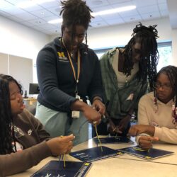 4 participants practicing tying surgical knots at the University of Michigan